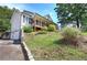 Exterior angle of the home with a sprawling front yard and a covered porch at 527 Cass White Nw Rd, Cartersville, GA 30121