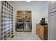 Laundry room with stainless steel washer and dryer plus rustic wood plank accent wall at 527 Cass White Nw Rd, Cartersville, GA 30121