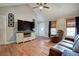 Inviting living room with hardwood floors, vaulted ceiling and a comfortable leather sofa and recliner at 527 Cass White Nw Rd, Cartersville, GA 30121