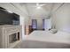 Comfortable main bedroom featuring a spacious closet, fireplace, en-suite bathroom and vaulted ceiling at 527 Cass White Nw Rd, Cartersville, GA 30121
