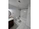 A renovated bathroom with a granite countertop vanity, tile floors, and a tiled shower/tub combo at 1202 Santa Fe Pkwy, Atlanta, GA 30350