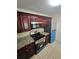 This modern kitchen features stainless steel appliances, granite countertops and dark wood cabinetry at 1202 Santa Fe Pkwy, Atlanta, GA 30350