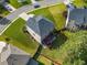 An aerial view of the house shows its large lot, two story layout, and big back deck and stairs at 1925 Piedmont Cove Ln, Cumming, GA 30040
