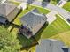 Aerial view of backyard showcasing the large deck, lush lawn, and mature trees at 1925 Piedmont Cove Ln, Cumming, GA 30040