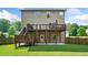 Expansive backyard features a deck for outdoor dining and plenty of green space at 1925 Piedmont Cove Ln, Cumming, GA 30040