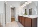 Bathroom featuring double sinks, tiled floors and a walk-in closet at 1925 Piedmont Cove Ln, Cumming, GA 30040