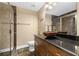 Elegant bathroom featuring granite countertops, modern fixtures, and a glass enclosed shower at 1925 Piedmont Cove Ln, Cumming, GA 30040