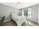 Cozy bedroom with hardwood floors, a window view, a new bed and a small work area at 1925 Piedmont Cove Ln, Cumming, GA 30040