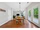 Cozy dining area with hardwood floors and a view to the living room and outdoor patio at 1925 Piedmont Cove Ln, Cumming, GA 30040