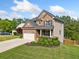 Charming two-story home with well-manicured landscaping, attached garage, and inviting entrance at 1925 Piedmont Cove Ln, Cumming, GA 30040