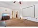 Spacious living room with a carpeted floor, a movie screen, and a fish tank at 1925 Piedmont Cove Ln, Cumming, GA 30040