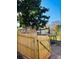 Inviting backyard with a wood fence, green tree, and a raised deck perfect for outdoor entertaining at 2021 Moody Drive Southwest, Atlanta, GA 30315