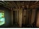 Interior of a dilapidated basement showing exposed walls and ceiling, with visible damage and debris at 2021 Moody Drive Southwest, Atlanta, GA 30315