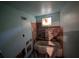 Dilapidated bathroom interior shows damaged walls, missing fixtures, and a worn-out bathtub at 2021 Moody Drive Southwest, Atlanta, GA 30315