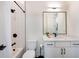 Modern bathroom featuring a sleek vanity with matte black hardware, and a shower with white subway tile at 417 E College Ave # 102, Decatur, GA 30030