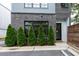 Exterior of a modern apartment building with grey brick and metal at 417 E College Ave # 102, Decatur, GA 30030
