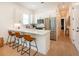 Charming kitchen with a breakfast bar, stainless steel appliances, and ample storage space at 417 E College Ave # 102, Decatur, GA 30030