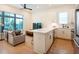 Open floor plan showcasing a bright kitchen with island connected to a cozy living area at 417 E College Ave # 102, Decatur, GA 30030
