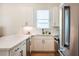 Well-lit kitchen with stainless steel appliances, white cabinets, and sleek countertops at 417 E College Ave # 102, Decatur, GA 30030