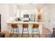 Modern kitchen features white cabinets, stainless steel appliances, and breakfast bar with seating at 417 E College Ave # 102, Decatur, GA 30030