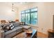 Cozy living room with natural light, contemporary decor, and hardwood flooring at 417 E College Ave # 102, Decatur, GA 30030