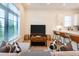 Comfortable living area with a plush sofa, stylish decor, and an open layout to the kitchen at 417 E College Ave # 102, Decatur, GA 30030