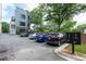 Parking lot with parking spaces and mailboxes in front of an apartment building at 417 E College Ave # 102, Decatur, GA 30030