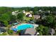 Aerial view of the home showcasing the community pool and proximity to surrounding houses and trees at 5281 Tormeall Trce, Suwanee, GA 30024