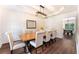 Elegant dining room featuring a large wooden table and modern chandelier at 5281 Tormeall Trce, Suwanee, GA 30024