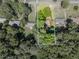 Aerial view of a secluded residential lot with mature trees and neighboring houses at 664 Mcburnette Ne Rd, Marietta, GA 30068