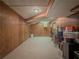Finished basement with wood paneling and tile flooring provides versatile space at 664 Mcburnette Ne Rd, Marietta, GA 30068