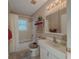 Bathroom featuring a bathtub, shower, vanity, and decorative wallpaper at 664 Mcburnette Ne Rd, Marietta, GA 30068