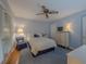 Cozy bedroom with blue walls, ceiling fan, and classic furnishings at 664 Mcburnette Ne Rd, Marietta, GA 30068