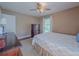 Bedroom featuring a bed, dresser, and a bright window with natural light at 664 Mcburnette Ne Rd, Marietta, GA 30068