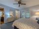 Bedroom with blue walls, ceiling fan, french doors to porch, dresser at 664 Mcburnette Ne Rd, Marietta, GA 30068