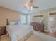 Cozy bedroom with a bed, dresser, and a glimpse into an adjoining bathroom at 664 Mcburnette Ne Rd, Marietta, GA 30068