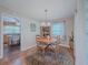 Cozy dining room with a round table, chandelier, and hardwood floors at 664 Mcburnette Ne Rd, Marietta, GA 30068
