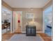 Hallway with hardwood floors, black cabinet and a view to office, bath and bedroom at 664 Mcburnette Ne Rd, Marietta, GA 30068