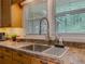 Spacious kitchen sink with natural light and view to the lush green backyard at 664 Mcburnette Ne Rd, Marietta, GA 30068