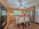 Charming kitchen featuring wood cabinets, stainless steel refrigerator, breakfast bar, and wood-look flooring at 664 Mcburnette Ne Rd, Marietta, GA 30068