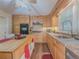 Bright kitchen with light wood cabinets, stainless steel appliances, breakfast bar, and a large window for natural light at 664 Mcburnette Ne Rd, Marietta, GA 30068