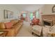 Spacious living room area with a brick fireplace and hardwood floors at 664 Mcburnette Ne Rd, Marietta, GA 30068