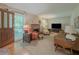 Comfortable living room featuring a brick fireplace and cozy furniture at 664 Mcburnette Ne Rd, Marietta, GA 30068