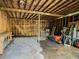 A shed features a partially open frame structure, exposed beams, and a concrete floor with storage at 664 Mcburnette Ne Rd, Marietta, GA 30068