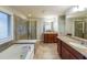 Primary bathroom features a tub, glass enclosed shower, and dual sink vanity at 991 Sibley Ne Ln, Atlanta, GA 30324