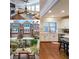 Bright home collage featuring the kitchen, living room, front exteriors, and a covered outdoor seating area at 991 Sibley Ne Ln, Atlanta, GA 30324