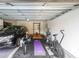 Spacious garage with a car, exercise equipment, and a weight lifting area at 991 Sibley Ne Ln, Atlanta, GA 30324