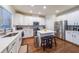 Modern kitchen with stainless steel appliances, white cabinetry and a center island at 991 Sibley Ne Ln, Atlanta, GA 30324