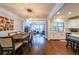 Open-concept kitchen, dining room featuring hardwood floors and modern lighting at 991 Sibley Ne Ln, Atlanta, GA 30324