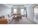 Comfortable living room area with a plush sofa, accent mirror, and natural light at 991 Sibley Ne Ln, Atlanta, GA 30324